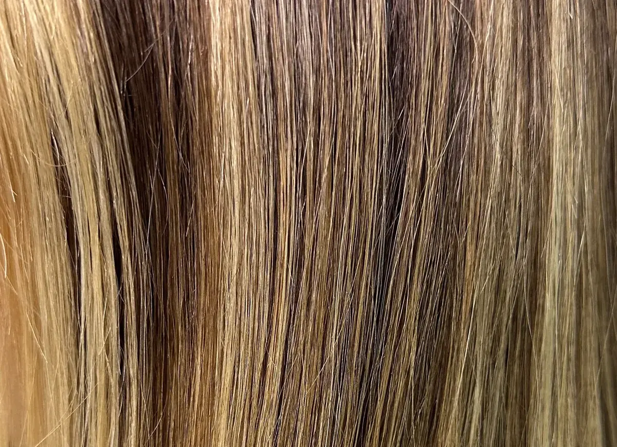 Superior Raw Hair texture close-up on a hand-painted balayage wig sample