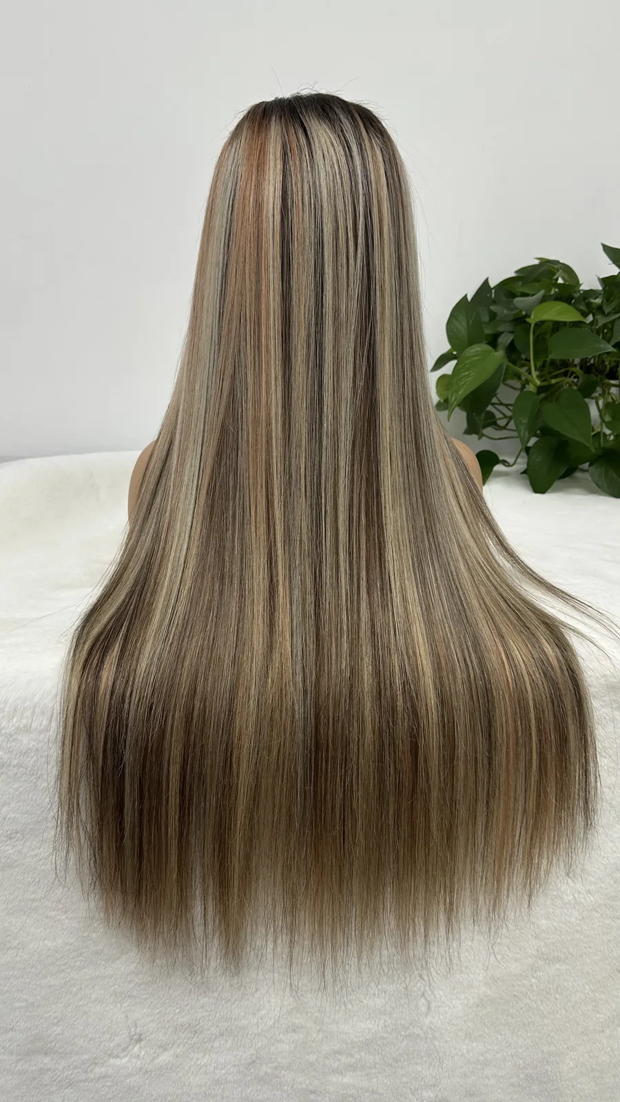 Back view of a NUSFACE straight human hair wig with highlighted lengths